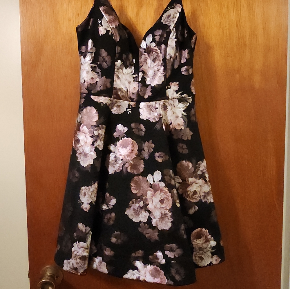 Black Dress With brown Flowers with a shiny finish.